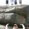 Scoutmaster holds rock